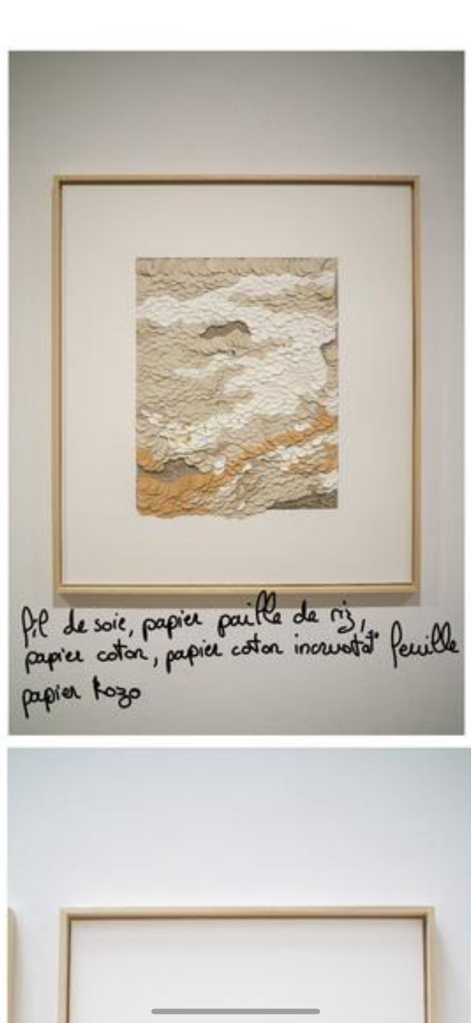 Detail of framed mixed-media artwork and handwritten notes