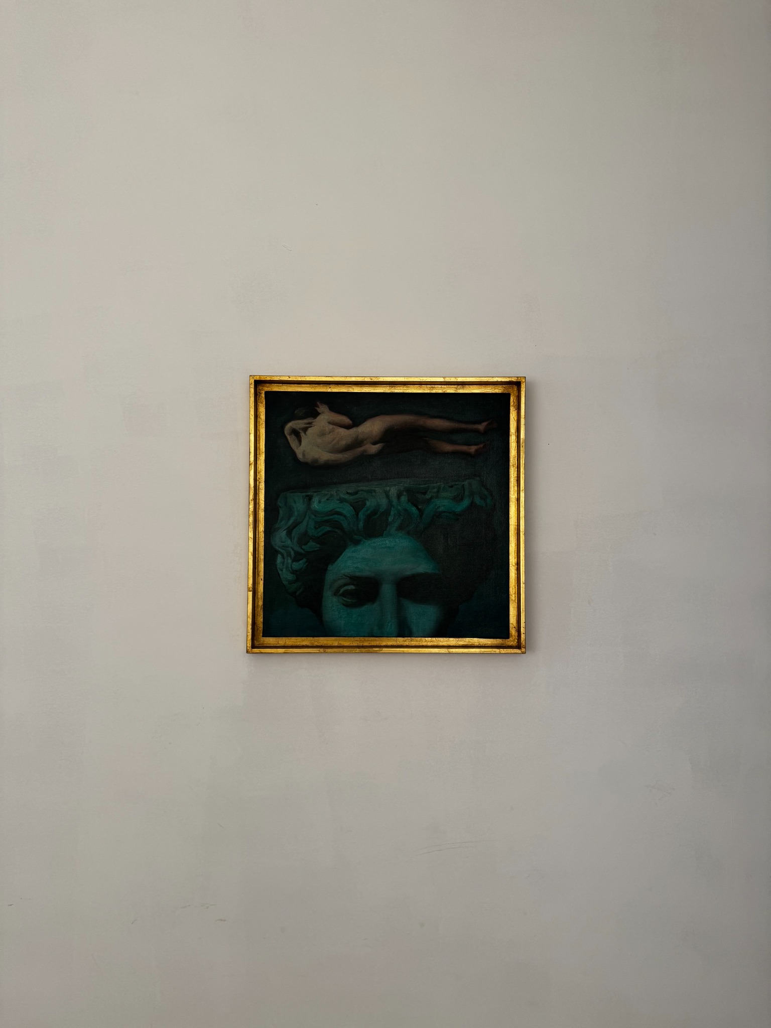 Framed painting installed on the gallery wall